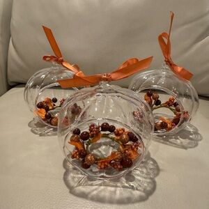 3 Glass Pumpkin Candle Displays by Luminara with Autumn garland and orange bows